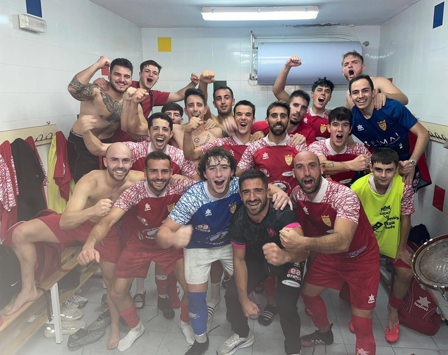 a group of men in a locker room football Sabiote